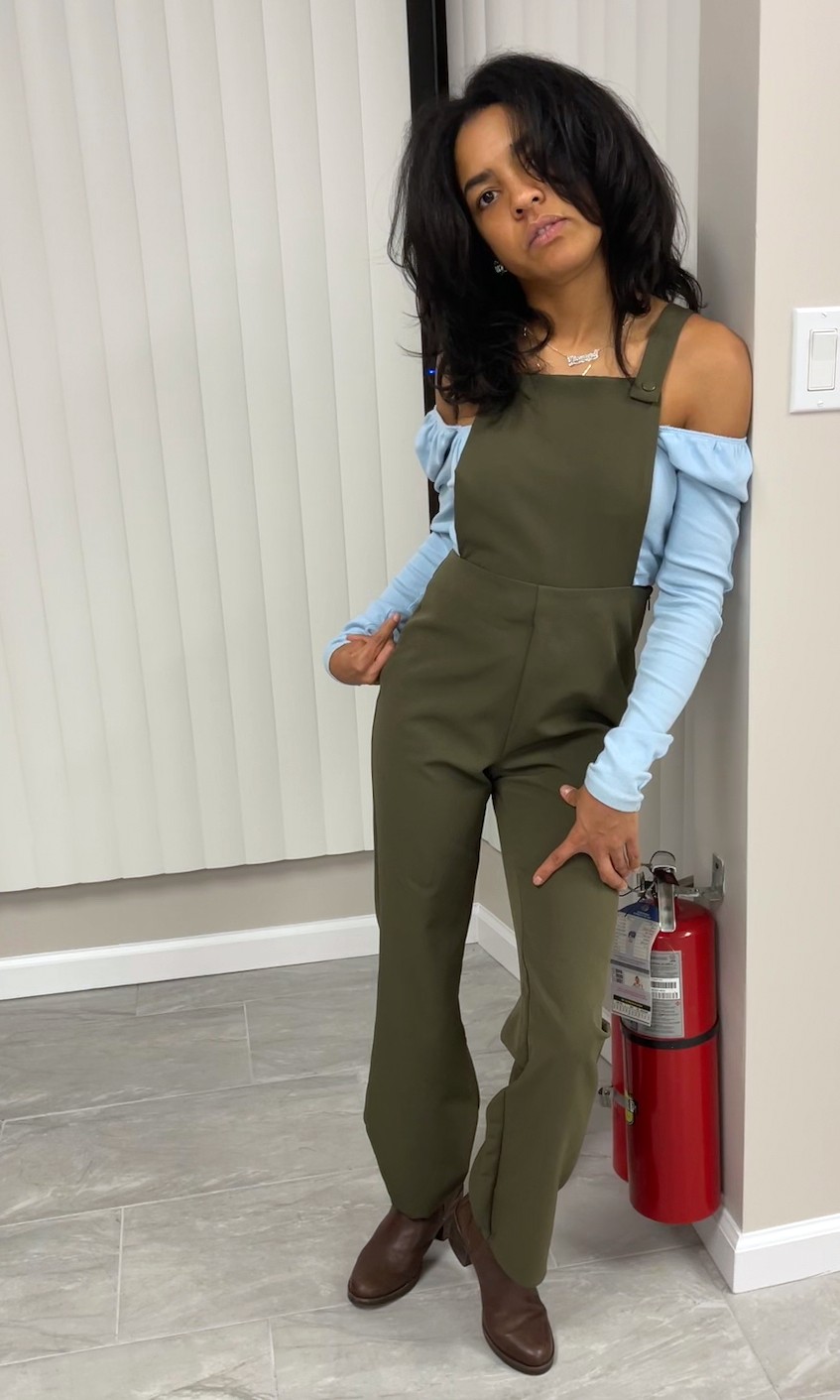 Image of a person with a disability looking straight to the camera with a serious facial expression while leaning on a wall.  She is wearing an olive green color overall with a baby blue long sleeves shirt. 


"Journey to Self-Acceptance with a Disability: Overcoming Limited Beliefs."